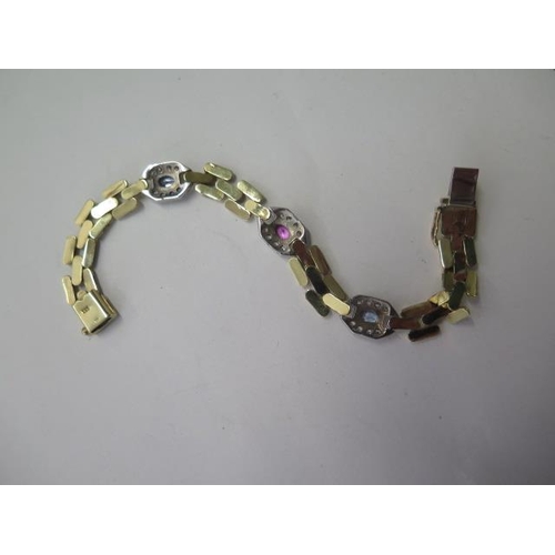 529 - A 9ct yellow and white gold multi gem link bracelet 18cm long, approx 11.4 grams, in good condition