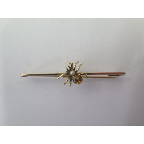 530 - A 15ct yellow gold spider citrine and pearl bar brooch, 5cm long, approx 2.9 grams, missing safety c... 