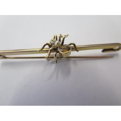 530 - A 15ct yellow gold spider citrine and pearl bar brooch, 5cm long, approx 2.9 grams, missing safety c... 