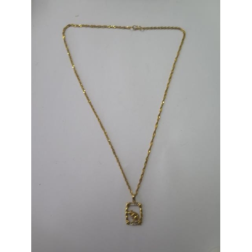 532 - An 850 yellow gold pendant and a 915 gold 46cm chain, both good, total weight approx 6.1 grams