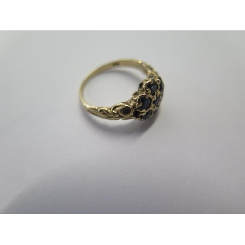 534 - A 9ct yellow gold seven stone ring, size J, approx 2.6 grams, some wear but generally good