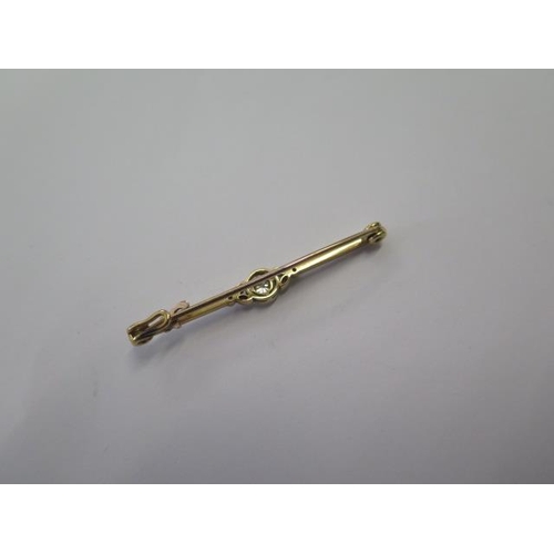 535 - A yellow gold diamond bar brooch, 52mm long, approx 4.3 grams, tests to approx 18ct, some bending to... 