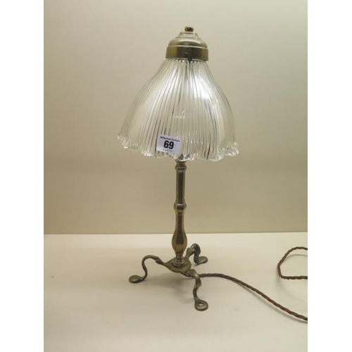 69 - A brass Pullman type table lamp with a holophane type glass shade, 44cm tall, working