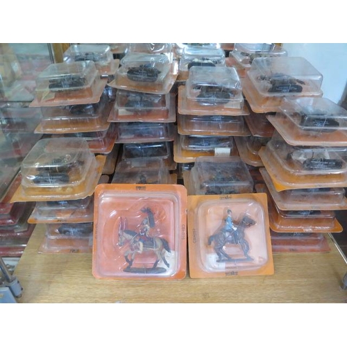 738 - A collection of 54 orange pack Del Prado lead figures on horseback, all boxed