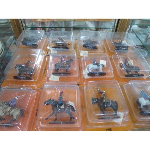 738 - A collection of 54 orange pack Del Prado lead figures on horseback, all boxed