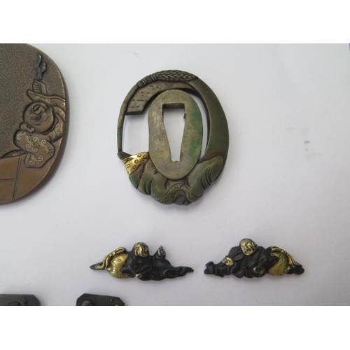 755 - Three Japanese tsuba sword guards and 8 decorations and a collar