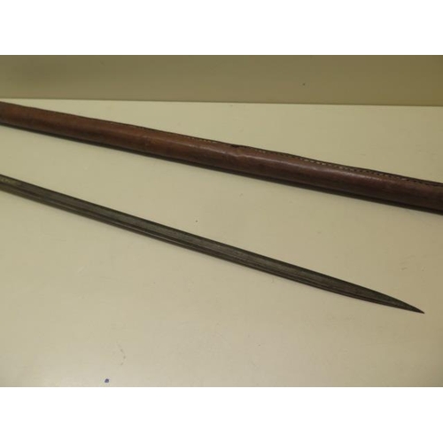 758 - An early 1900s Indian sword stick with leather grip and scabbard, blade length 53cm, total length 91... 