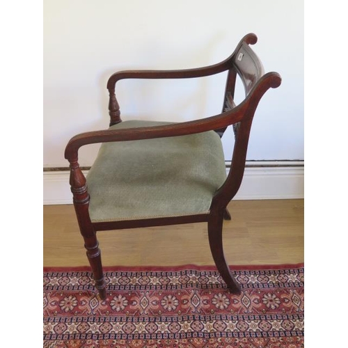 89 - A Georgian mahogany open armchair with upholstered seat