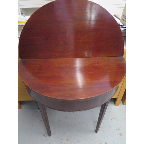 95 - A Georgian demi lune fan inlaid mahogany inlaid fold over tea table, 72cm tall x 86cm wide