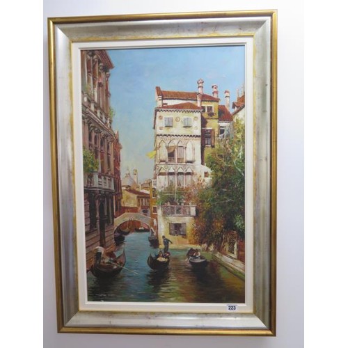 223 - An unsigned oil on canvas canal scene Venice, in a gilt and silvered frame, frame size 85cm x 60cm