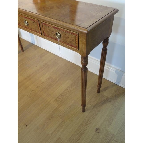 13 - A new burr oak four drawer hall table on turned reeded legs, made by a local craftsman to a high sta... 