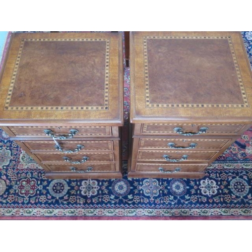 22 - A pair of 4 drawer bedside chests re-veneered with checker inlay, 73cm tall x 44cm x 40cm