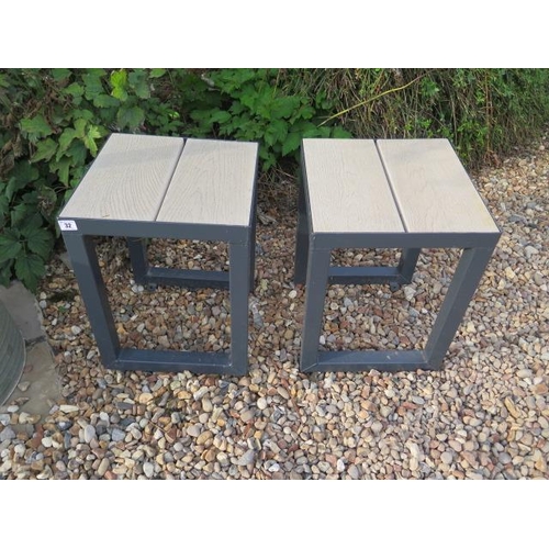 32 - A pair of steel garden / patio stools with wood effect poly seats, 47cm tall x 36cm x 36cm