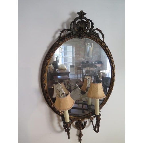 62 - A pair of gilt girondelle twin branch wall mirrors, 100cm x 56cm, some cracking and minor losses, sp... 