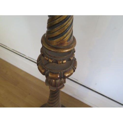 63 - A gilt wood standard lamp, 183cm tall, will need re-wiring, some staining to shade, removed from a C... 