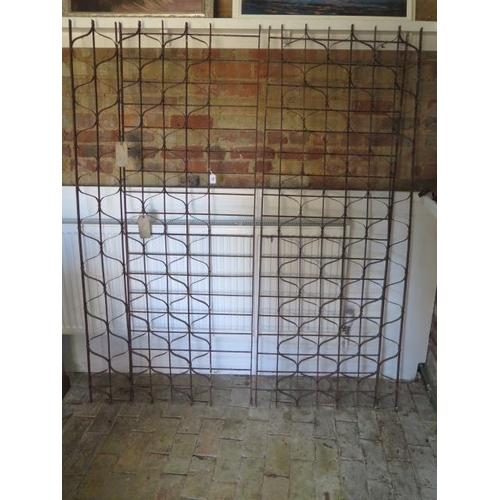 71 - A wrought iron 2 section County House wine rack, each section 184cm x 62cm, removed from a Country M... 