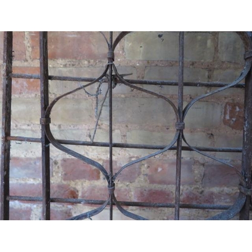 71 - A wrought iron 2 section County House wine rack, each section 184cm x 62cm, removed from a Country M... 