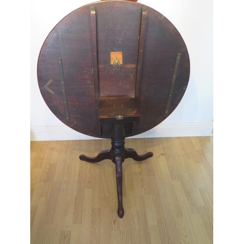 72 - A Georgian mahogany tilt top table on a tripod base, 71cm tall x 98xm diameter