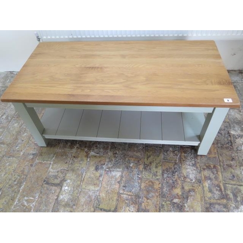 8 - A painted coffee table with an undertier and oak top, 45cm tall x 110cm x 54cm