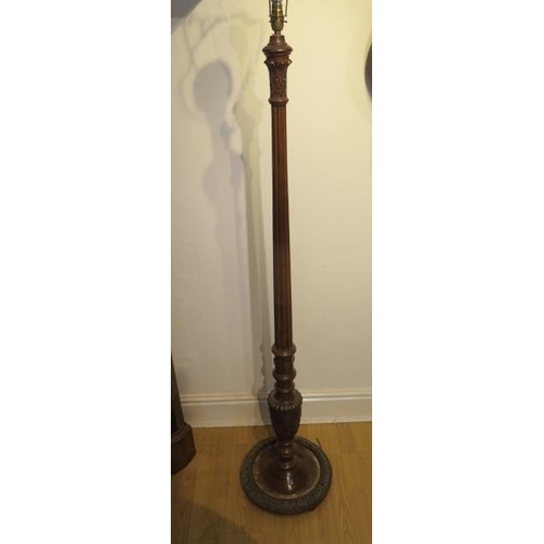 83 - A carved mahogany standard lamp, needs re-wiring, 178cm tall