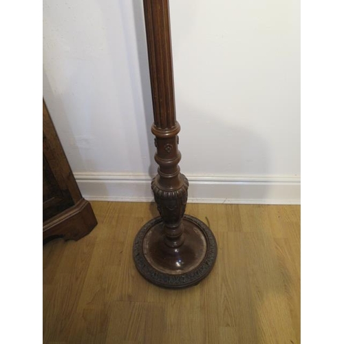 83 - A carved mahogany standard lamp, needs re-wiring, 178cm tall