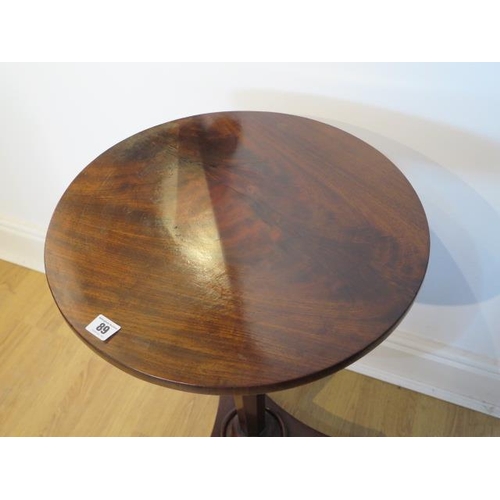 89 - A 19th century mahogany wine table on an octagonal tapering column and tripartite platform base, 70c... 