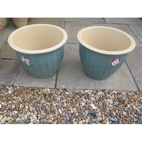 41 - A pair of frost proof Sicilia garden planters, 31cm tall