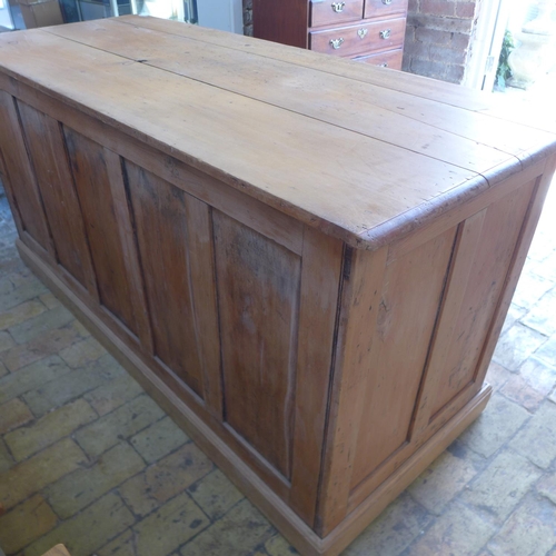 3 - A Victorian stripped pine 8 drawer kneehole desk with panelled back, 80cm tall x 163cm x 67cm
