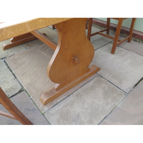 33 - An oak dining table and 4 chairs, 160cm long x 91cm wide x 70cm high