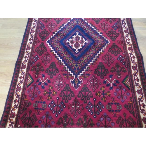 193 - A hand knotted woollen Meimeh rug, 3.23m x 1.10m