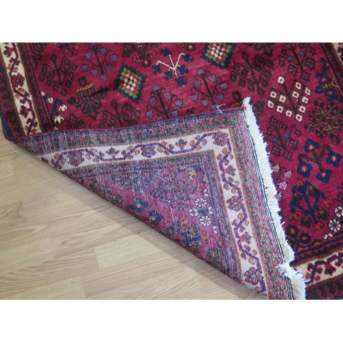 193 - A hand knotted woollen Meimeh rug, 3.23m x 1.10m