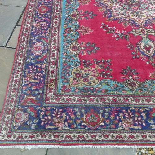 200 - An Azerbaijan hand knotted semi antique hand knotted run with a red fireld - 345cm x 248cm