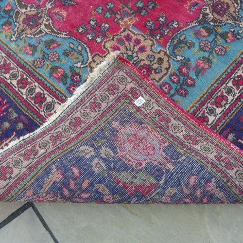 200 - An Azerbaijan hand knotted semi antique hand knotted run with a red fireld - 345cm x 248cm