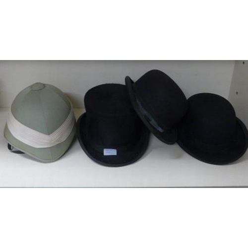 244 - A top hat size 7 1/4, two bowler hats and a modern Pith helmet size 59