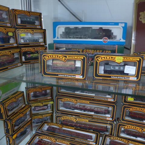 259 - A collection of 33 OO gauge mainline rolling stock with boxes - an Airfix LMS 4454 Loco, Mainline 56... 