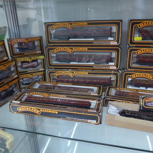 259 - A collection of 33 OO gauge mainline rolling stock with boxes - an Airfix LMS 4454 Loco, Mainline 56... 