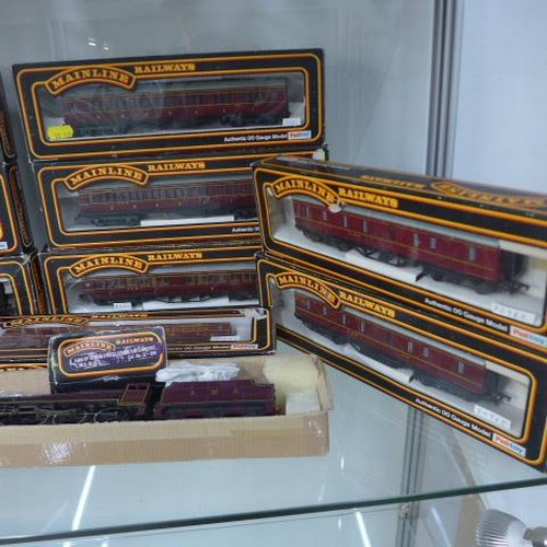 259 - A collection of 33 OO gauge mainline rolling stock with boxes - an Airfix LMS 4454 Loco, Mainline 56... 