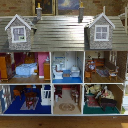 264 - A six room dolls house with conservatory, fully furnished, with lift out front - Height 71cm x Width... 