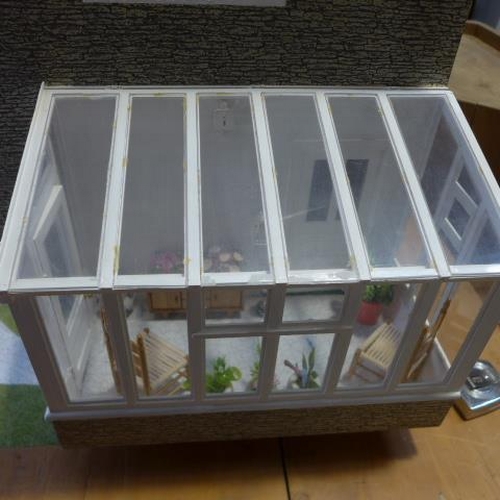 264 - A six room dolls house with conservatory, fully furnished, with lift out front - Height 71cm x Width... 