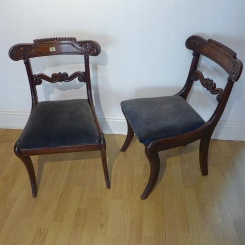 67 - A pair of 19th century mahogany sabre leg side chairs