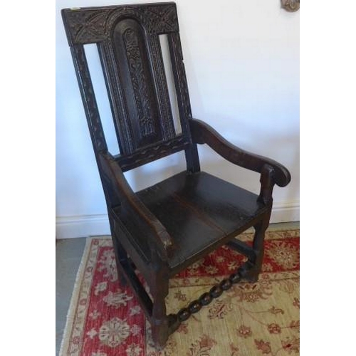 68 - A 17th century and later oak armchair with carved panelled back - Height 106cm x Width 53cm - with g... 