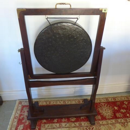 69 - A vintage mahogany framed bronze gong with striker - Height 101cm x Width 66cm