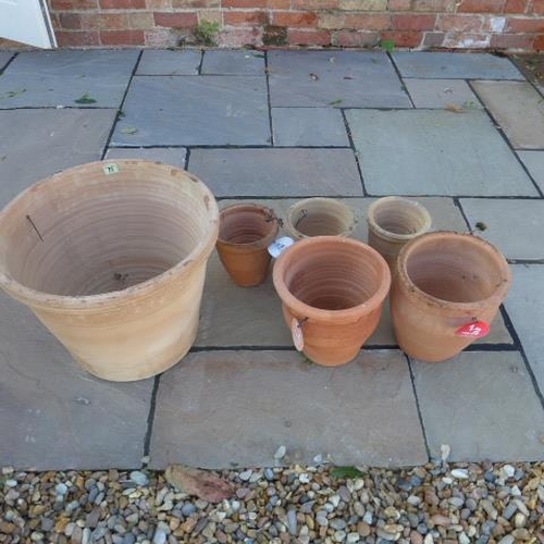 77 - A large terracotta pot - Height 37cm - and five smaller pots