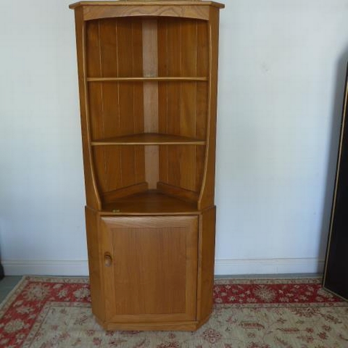 93 - An Ercol blond elm corner cupboard with an open top above a cupboard - Height 179cm x Depth 52cm - i... 