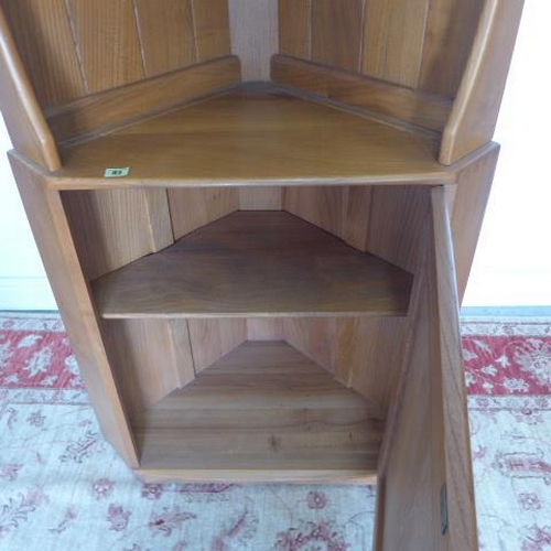 93 - An Ercol blond elm corner cupboard with an open top above a cupboard - Height 179cm x Depth 52cm - i... 