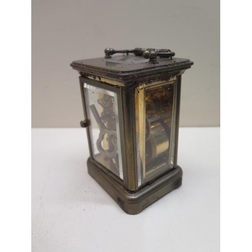 203 - A Matthew Norman brass alarm carriage clock - Height 12cm - running, needs a tidy up , one glass chi... 