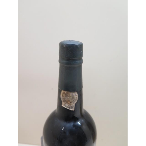 499 - A 75cl bottle of Taylors 1977 Vintage Port - seal good