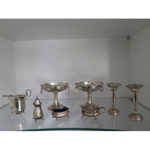 503 - A silver cruet set, a pair of weighted silver vases, a pair of sweetmeat stands - height 9.5cm - and... 