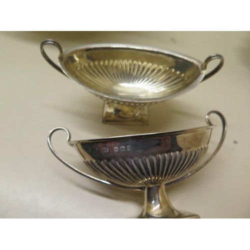 509 - Two silver footed dishes, a pair of silver salts, a silver pepper and a silver serviette ring - tota... 