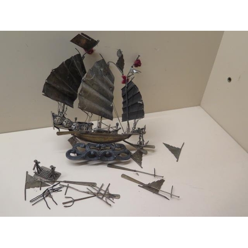 516 - An Oriental white metal gun boat with loose pieces - total weight approx 6 troy oz - with wooden bas... 